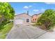 This charming home features a one-car garage, well-maintained landscaping, and a cozy front entrance at 2317 Santa Lucia St, Kissimmee, FL 34743