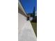 Backyard of house, concrete walkway, and grassy area at 2317 Santa Lucia St, Kissimmee, FL 34743