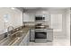 Well-equipped kitchen featuring stainless steel appliances and granite countertops at 2317 Santa Lucia St, Kissimmee, FL 34743