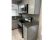 Modern kitchen with gray cabinets and granite counters at 2317 Santa Lucia St, Kissimmee, FL 34743