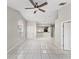 Open living area with tile floors and a view into the kitchen at 2317 Santa Lucia St, Kissimmee, FL 34743