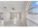 This is a living room with tile floors and a large arched window at 2317 Santa Lucia St, Kissimmee, FL 34743