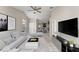 Bright, modern living room with tile floors and open concept design at 2317 Santa Lucia St, Kissimmee, FL 34743