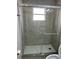 Clean shower with glass enclosure and tiled walls at 2317 Santa Lucia St, Kissimmee, FL 34743