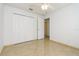 Bedroom with double door closet and ceiling fan at 2543 Sage Dr, Kissimmee, FL 34758