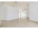 Open living room with tile floors and neutral walls at 2543 Sage Dr, Kissimmee, FL 34758