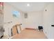 Unfinished basement area with light wood floors and a window at 2913 W Amelia St, Orlando, FL 32805