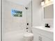Clean bathroom featuring a white vanity and marble tile at 2913 W Amelia St, Orlando, FL 32805