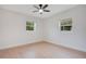 Bright bedroom with light wood flooring and ceiling fan at 2913 W Amelia St, Orlando, FL 32805