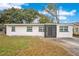 Newly renovated home with a modern facade and well-maintained lawn at 2913 W Amelia St, Orlando, FL 32805