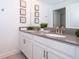 Double vanity bathroom with gray countertops and modern fixtures at 2974 Protagonist St, Kissimmee, FL 34746