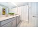 Bright bathroom features double sinks, shower and bath at 2974 Protagonist St, Kissimmee, FL 34746