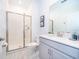 Bright bathroom featuring tiled walk-in shower and neutral vanity at 2974 Protagonist St, Kissimmee, FL 34746