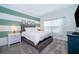 Bedroom with gray-toned wall and a queen bed at 2974 Protagonist St, Kissimmee, FL 34746
