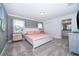 Spacious bedroom with a queen bed, and ensuite bathroom at 2974 Protagonist St, Kissimmee, FL 34746