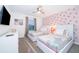 The Mickey Mouse themed bedroom has two beds and a ceiling fan at 2974 Protagonist St, Kissimmee, FL 34746