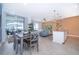Grey dining table with six chairs, near kitchen and living room at 2974 Protagonist St, Kissimmee, FL 34746