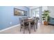 Simple dining area with light grey table and chairs at 2974 Protagonist St, Kissimmee, FL 34746