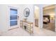 Bright foyer with marble floors, elegant console table and accent mirror, leading to the main living areas at 2974 Protagonist St, Kissimmee, FL 34746