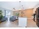 Modern kitchen with island, stainless steel appliances, and breakfast bar at 2974 Protagonist St, Kissimmee, FL 34746