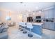 Well-designed kitchen features a breakfast bar, stainless appliances, and an open concept layout at 2974 Protagonist St, Kissimmee, FL 34746