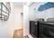 Functional laundry room with modern washer and dryer, built-in shelving, and convenient access at 2974 Protagonist St, Kissimmee, FL 34746