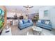 Open living space featuring comfy sofas and a large TV at 2974 Protagonist St, Kissimmee, FL 34746