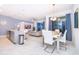 Open-concept living space showcasing a modern kitchen, dining area, and comfortable living room with natural light at 2974 Protagonist St, Kissimmee, FL 34746