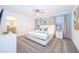 Bright main bedroom featuring a ceiling fan, walk-in closet, and ensuite bathroom at 2974 Protagonist St, Kissimmee, FL 34746