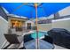 Private pool area with outdoor seating, a grill, and enclosed space, perfect for relaxing and entertaining at 2974 Protagonist St, Kissimmee, FL 34746