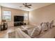 Living room with large TV, seating area and view of backyard at 3018 Bargate St, Orlando, FL 32824