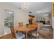 Charming dining room with wood table, four chairs, and chandelier at 3024 Harbour Landing Way, Casselberry, FL 32707