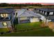 Aerial view of house backyard and golf course at dusk at 3032 Kensington Ave, Davenport, FL 33837