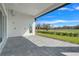 Large covered patio perfect for outdoor entertaining, overlooking the golf course at 3032 Kensington Ave, Davenport, FL 33837