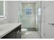 Bright bathroom with walk-in shower and gray tile at 3032 Kensington Ave, Davenport, FL 33837