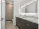 Bathroom boasts a modern vanity and walk-in shower at 3032 Kensington Ave, Davenport, FL 33837