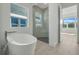Spa-like bathroom with a large shower and soaking tub at 3032 Kensington Ave, Davenport, FL 33837