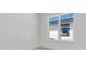 Spacious bedroom featuring a large window and wood-look floors at 3032 Kensington Ave, Davenport, FL 33837