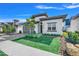 Modern house exterior with gray garage door and palm tree at 3032 Kensington Ave, Davenport, FL 33837