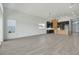 Modern kitchen boasts dark cabinetry, an island, and wood flooring at 3032 Kensington Ave, Davenport, FL 33837