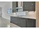 Modern kitchen with dark gray cabinets and white quartz countertops at 3032 Kensington Ave, Davenport, FL 33837