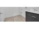 Convenient laundry room with sink and dark cabinets at 3032 Kensington Ave, Davenport, FL 33837