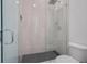 Sleek walk-in shower with glass enclosure and gray tile at 3032 Kensington Ave, Davenport, FL 33837