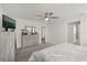 Main bedroom with dresser, large bed, and access to bathroom at 3046 Slough Creek Dr, Kissimmee, FL 34744