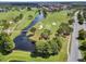 Aerial view of golf course with water features at 3736 Brookmyra Dr, Orlando, FL 32837