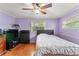 Bedroom with wood floors, ceiling fan, and dresser at 41 Apple Hill Holw, Casselberry, FL 32707