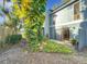 Landscaped backyard with lush foliage and a large tree at 421 Sheoah Blvd # 5, Winter Springs, FL 32708