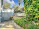 Private backyard with lush landscaping and wooden fence at 421 Sheoah Blvd # 5, Winter Springs, FL 32708