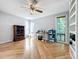 Spacious bedroom with hardwood floors, ceiling fan, and built-in shelving at 421 Sheoah Blvd # 5, Winter Springs, FL 32708