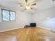 Bright bedroom with hardwood floors, ceiling fan, and large window at 421 Sheoah Blvd # 5, Winter Springs, FL 32708